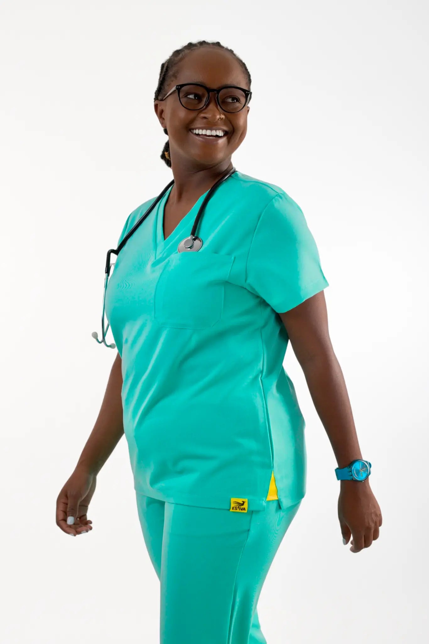 Estiva light turquoise medical scrub top worn by healthcare professional