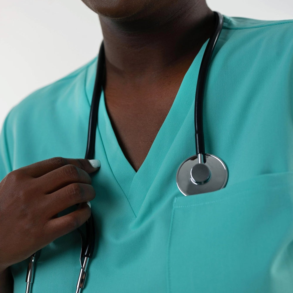 
                  
                    TOP - LIGHT TURQUOISE medical scrubs by Estiva – modern uniform for healthcare professionals
                  
                