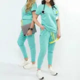 Women's medical scrub set by Estiva, modern scrub top and pants designed for comfort and durability