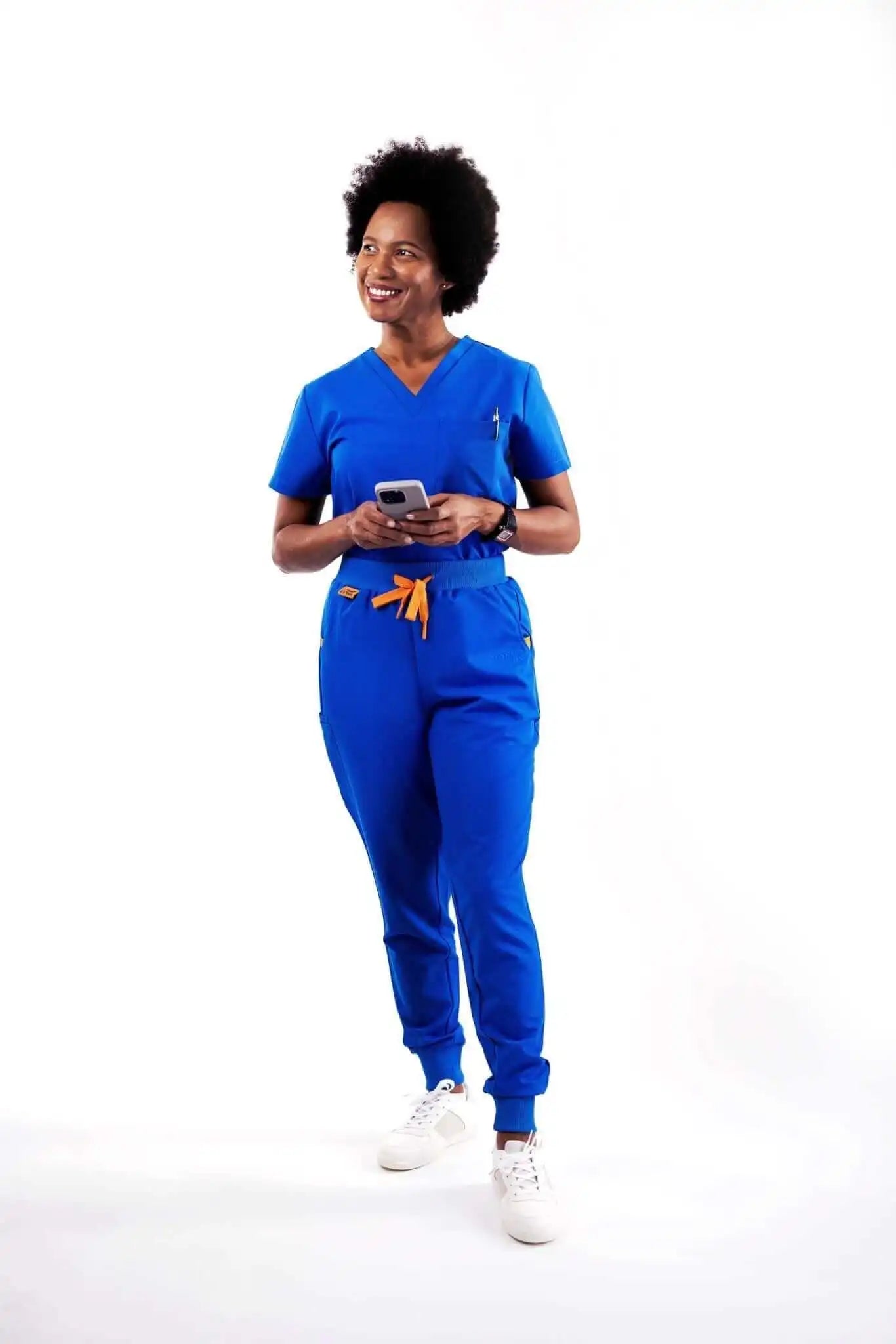 healthcare professional wearing women's royal blue medical scrub set by estiva
